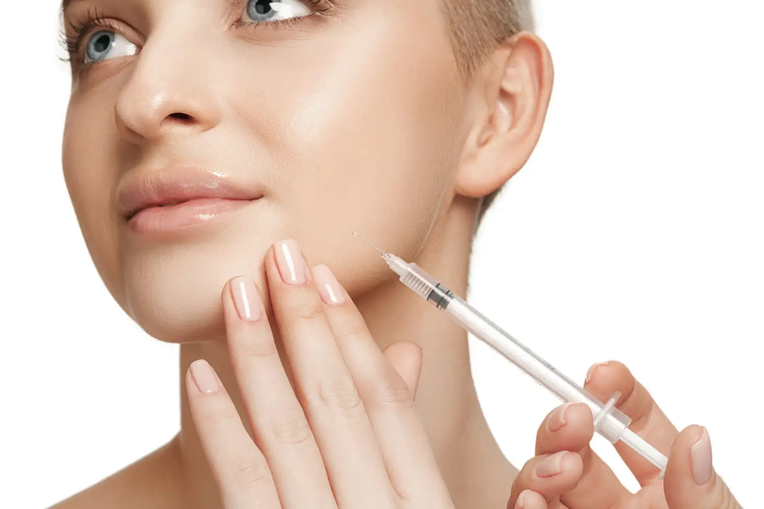 Young woman holding still as she receives a beauty treatment injection near her cheek.