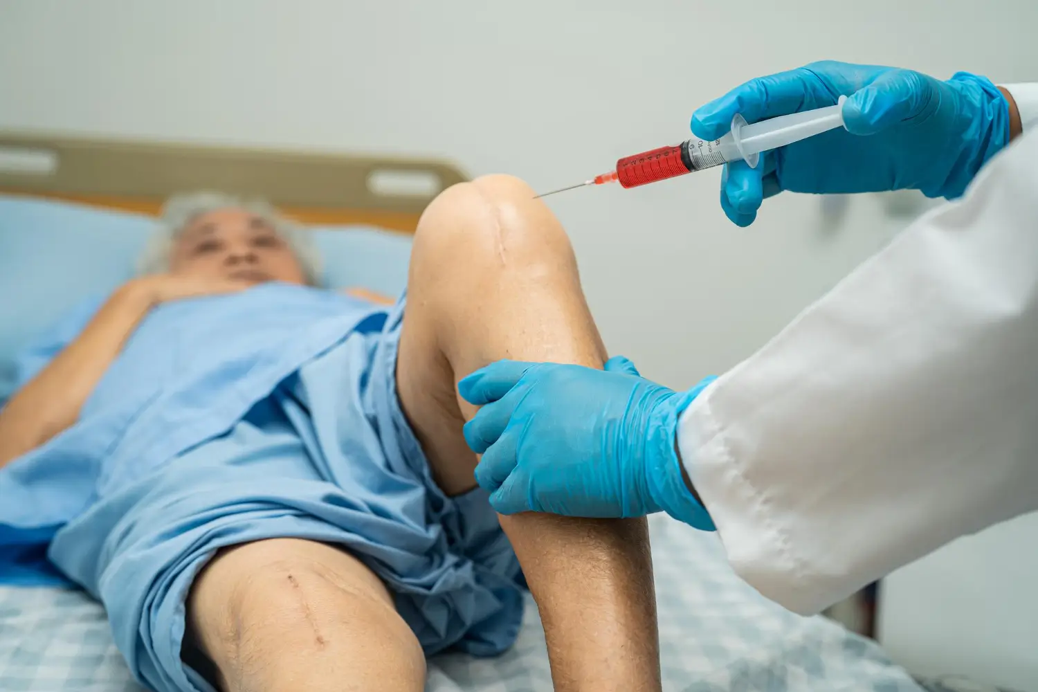 patient in bed for knee injection