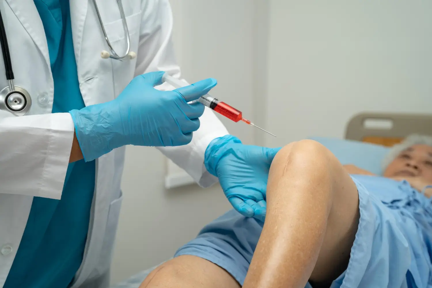 patient receiving knee injection