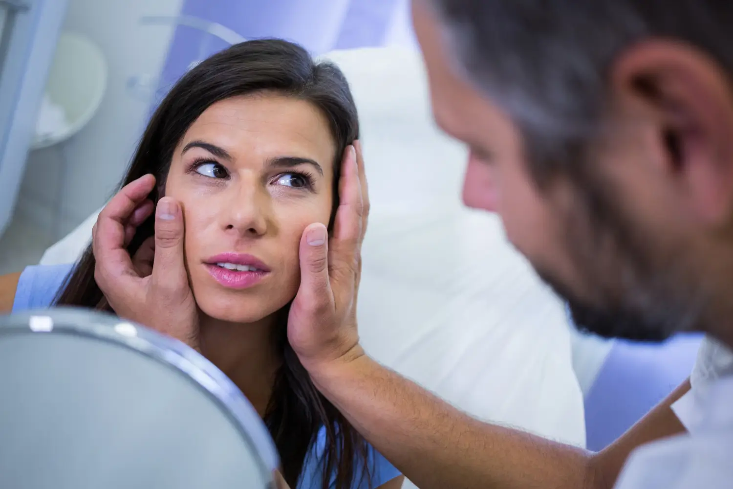 practitioner checking patient after treatment