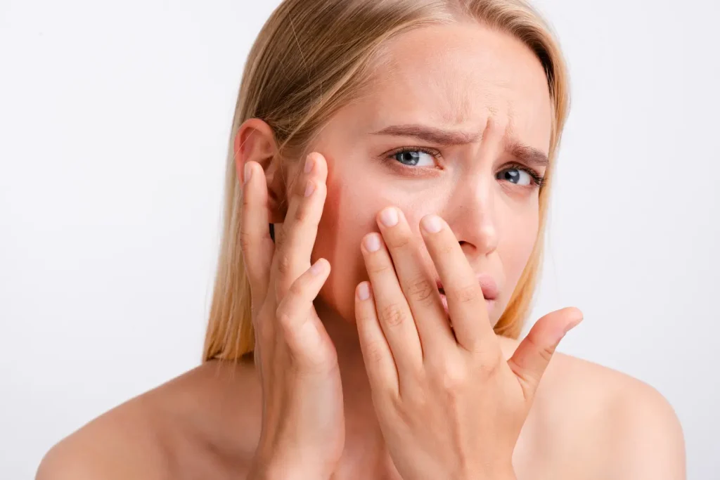 patient is sad about the dark spot in her face