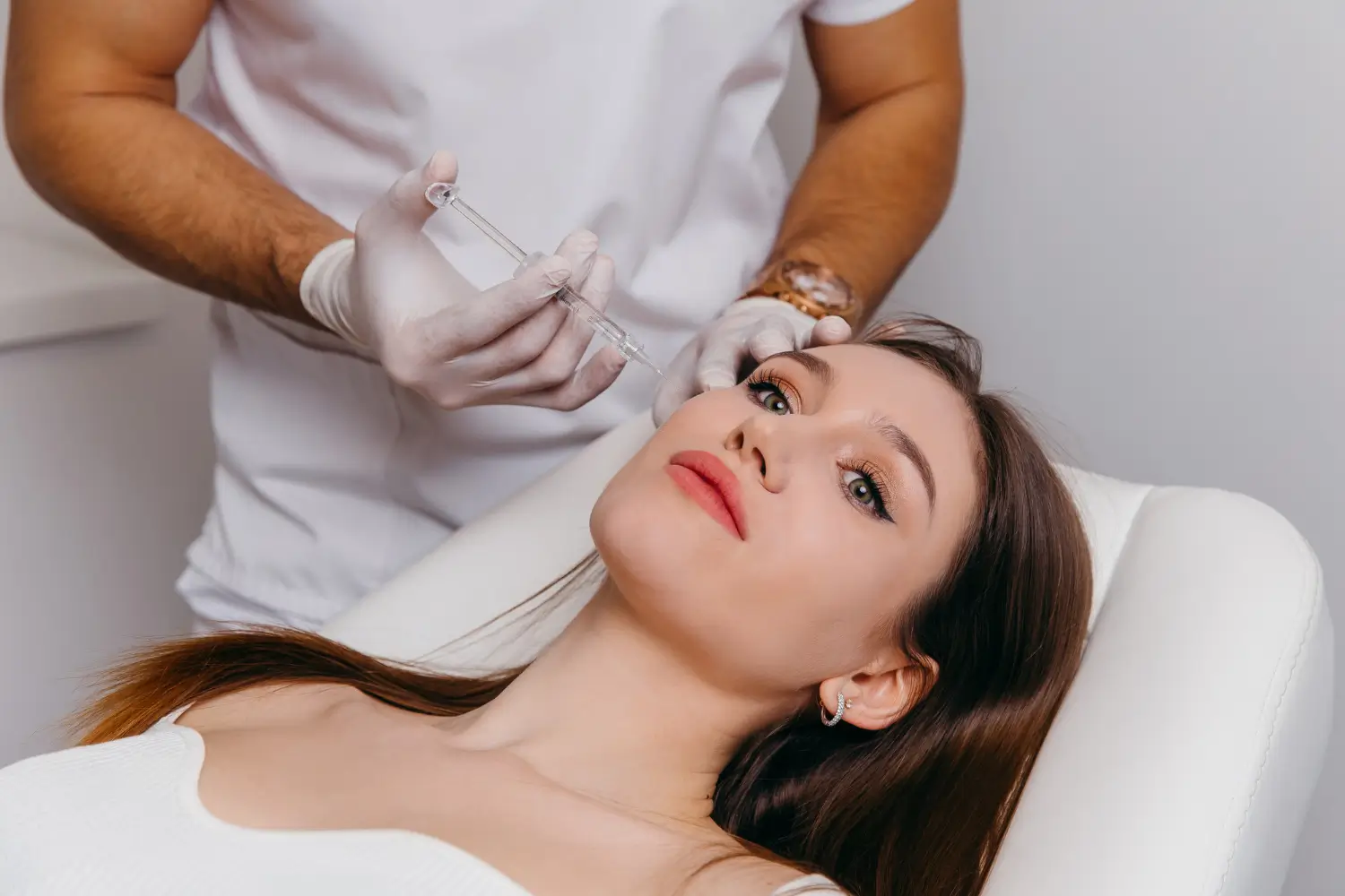 female patient receives facial treatment