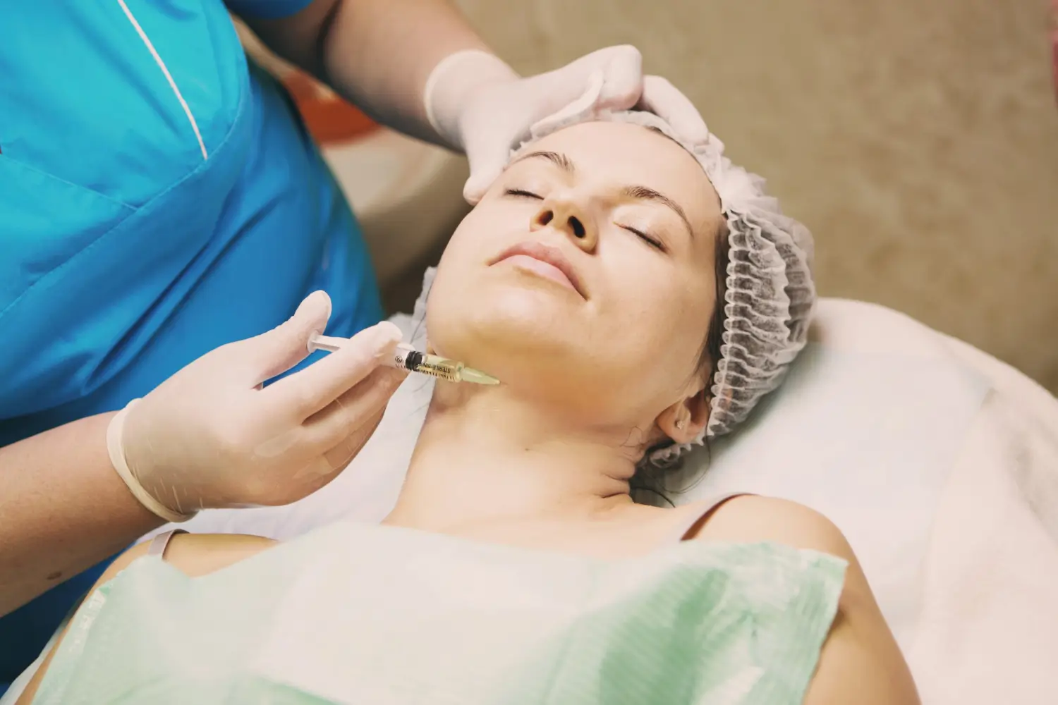 woman receives injection for skin rejuvenation