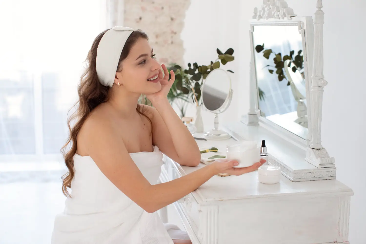 patient admiring her glowing skin in the mirror