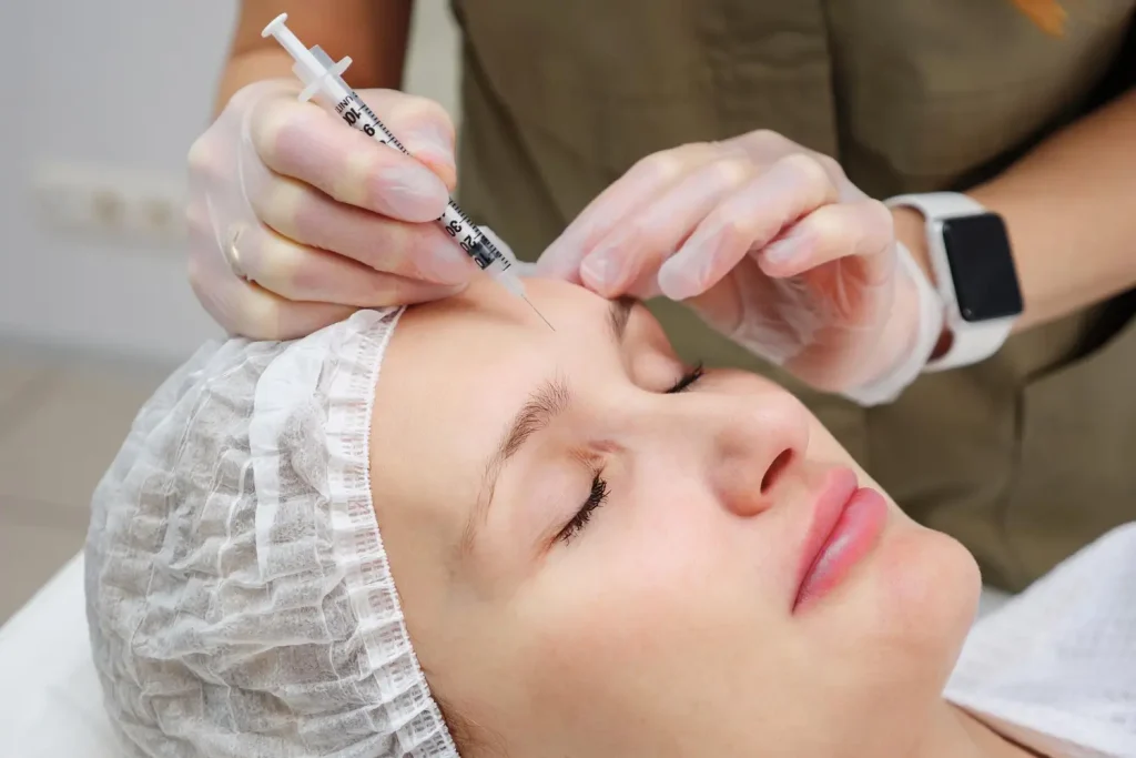 patient is getting an injection for her fine lines