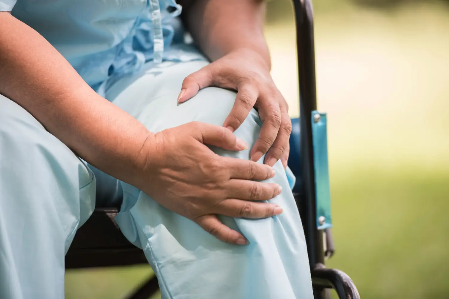 elderly woman suffering from painful knee