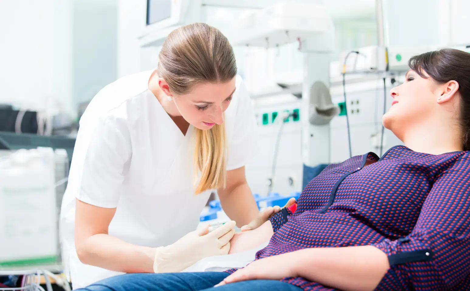 checking the patient's arm