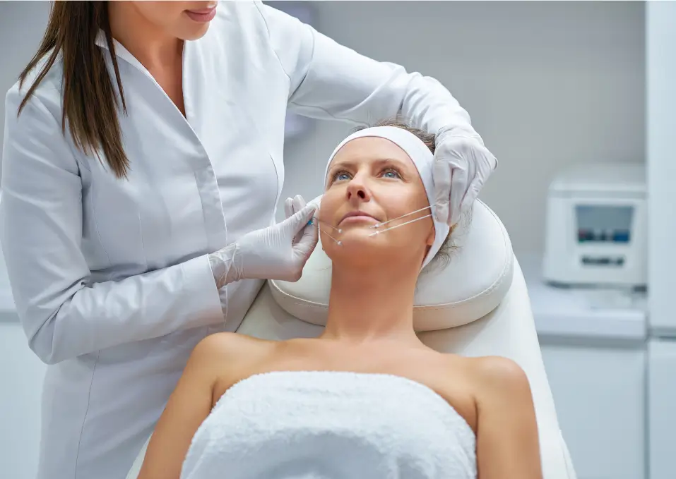 patient lies in bed for the thread procedure