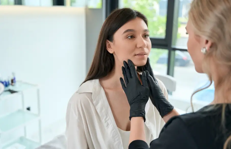 practitioner assessing the patient's facial structure