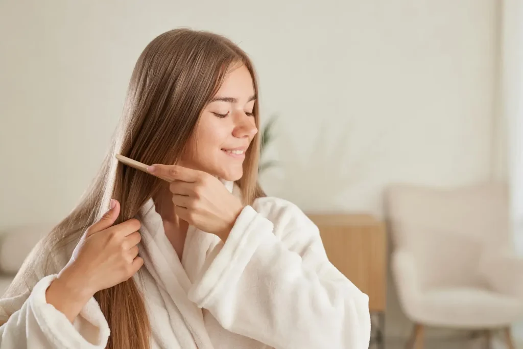 she's brushing her smooth, soft hair