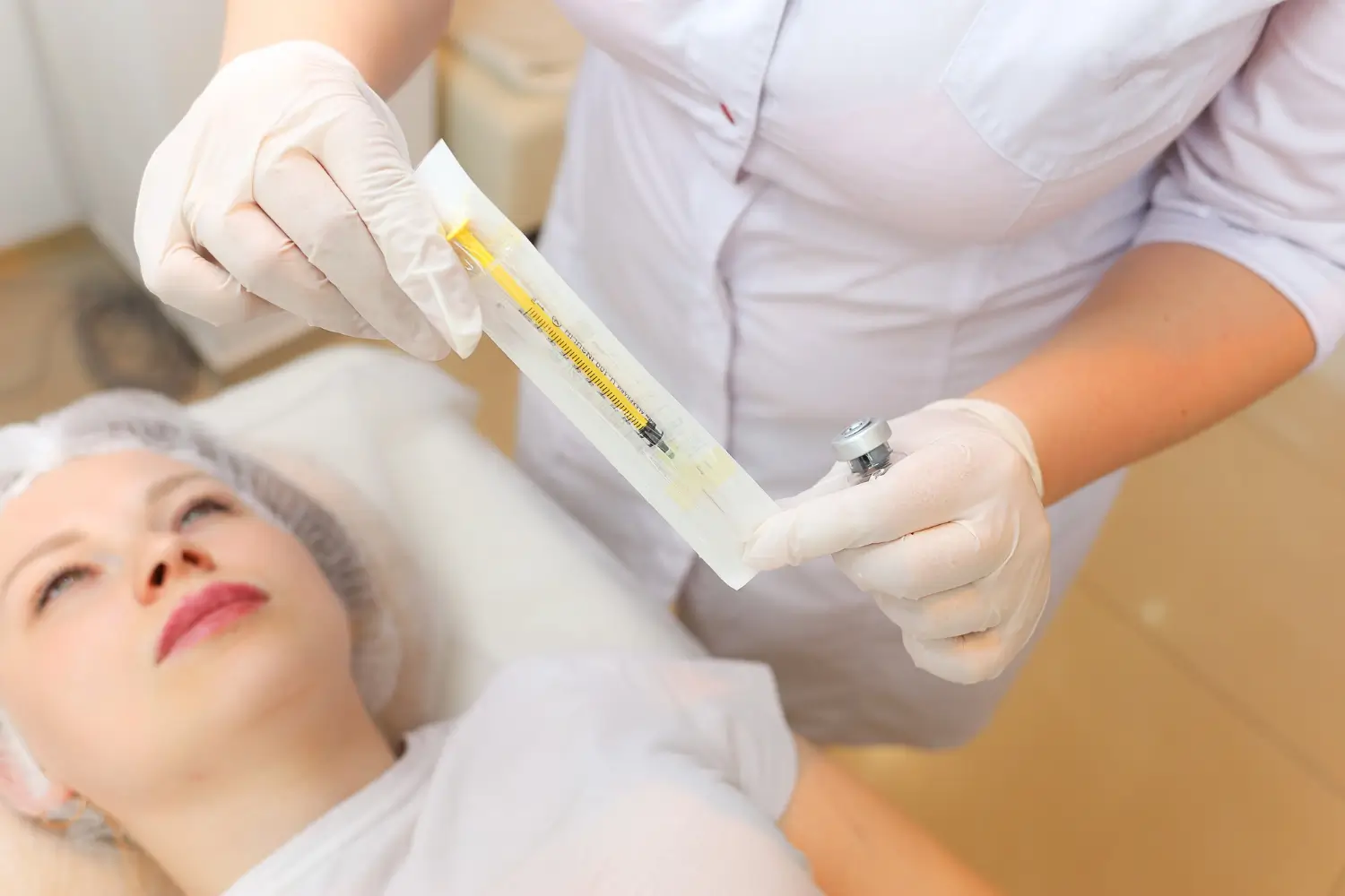 doctor showing the syringe before injecting