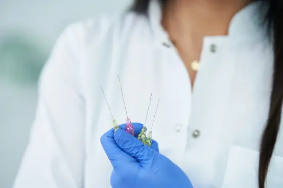 doctor shows the needles for the procedure